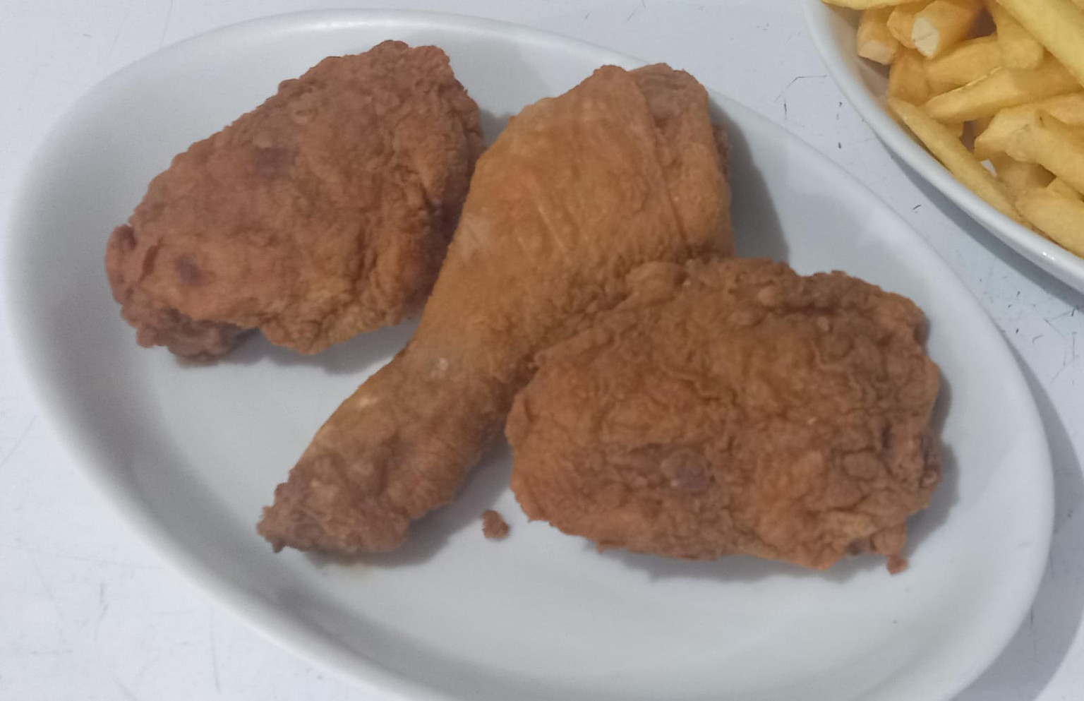 PEDAÇO DE FRANGO FRITO